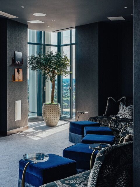Modern high-rise apartment in London with stylish interior and panoramic city views.
