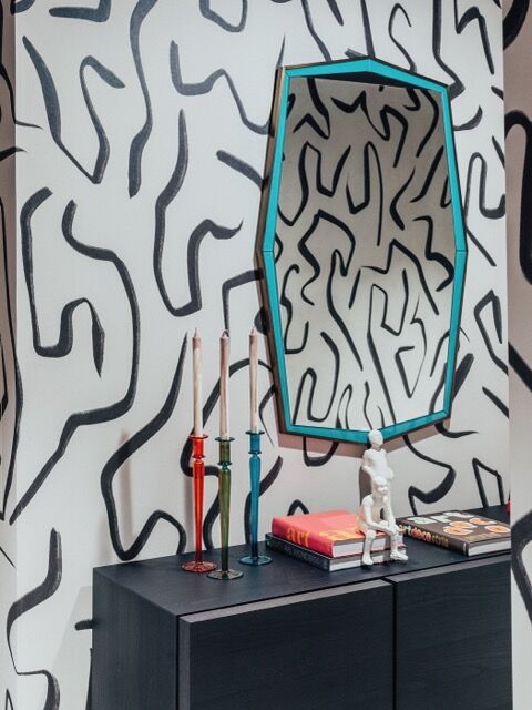 Stylish modern interior with abstract wall art and decorative accessories.