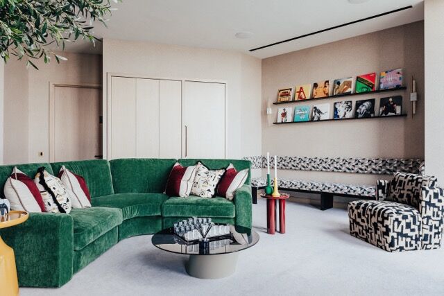 Elegant interior with modern furniture and vibrant accents in a high-end London apartment.