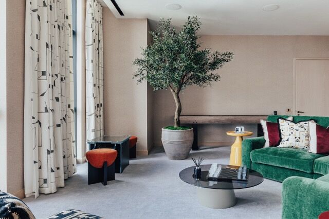 Luxury apartment interior with city skyline views from One Nine Elms, London. Modern decor and spaci.