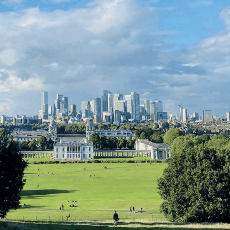 Beautiful view of London skyline and expansive green park, highlighting prime real estate and invest.