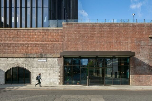 Modern urban building entrance in Manchester city center.