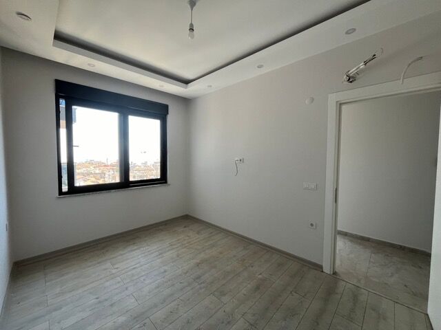 Bright interior of a modern 1-bedroom apartment with full amenities in Alanya.