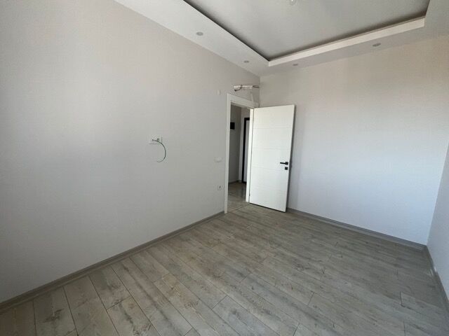 Bright empty 1-bedroom apartment with modern design in Alanya.