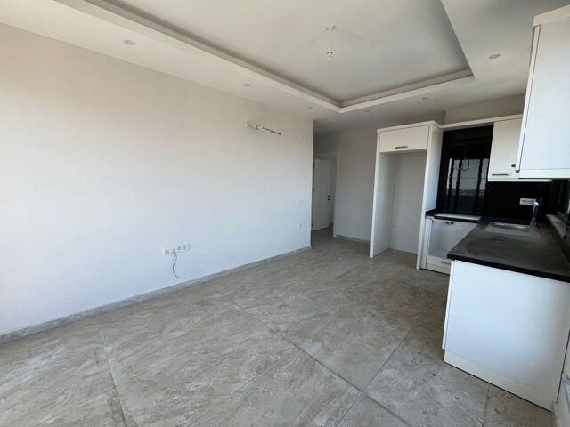 Bright interior of a modern 1-bedroom apartment in Alanya with full amenities.