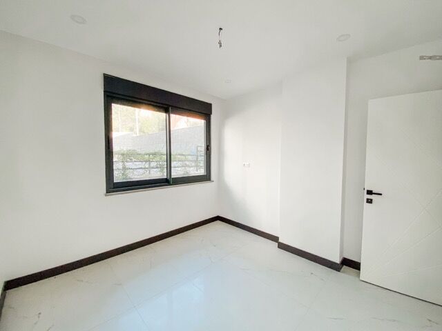 Bright bedroom with large window and full amenities in Kestel, Alanya.