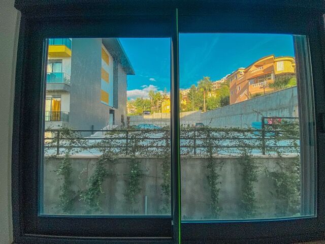 Bright view of Kestel from a modern apartment window in Alanya.