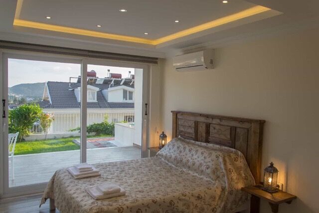 Furnished 4-bedroom villa with garden and private pool in Fethiye, offering modern comfort and sceni.