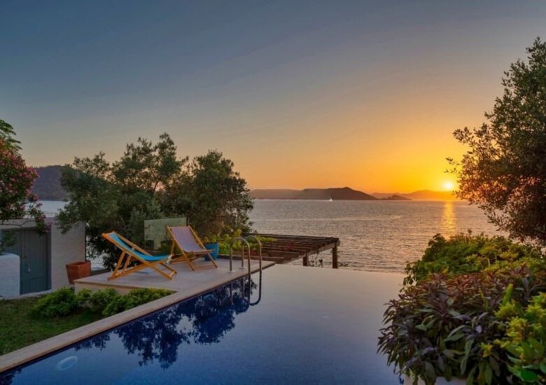Seafront villa with private pier on Sovalye Island, Fethiye, offering stunning sunset views over the.