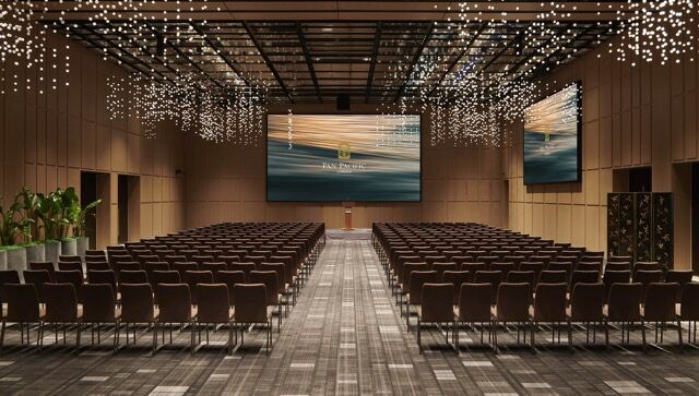 Modern conference room with elegant lighting and large screens at Pan Pacific London.