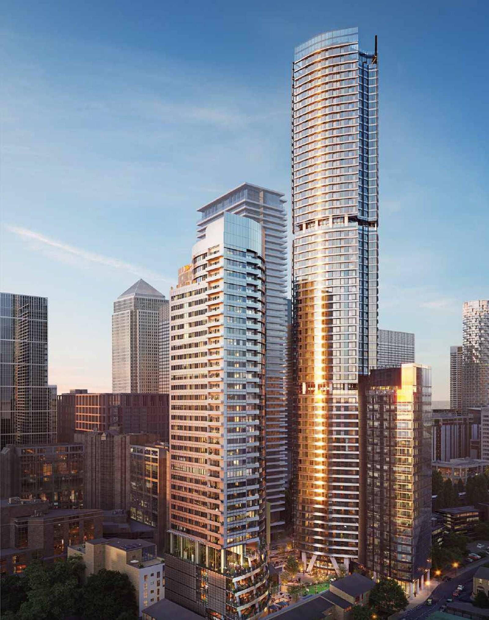 Modern skyscrapers in Canary Wharf with stunning river views and luxury apartments.