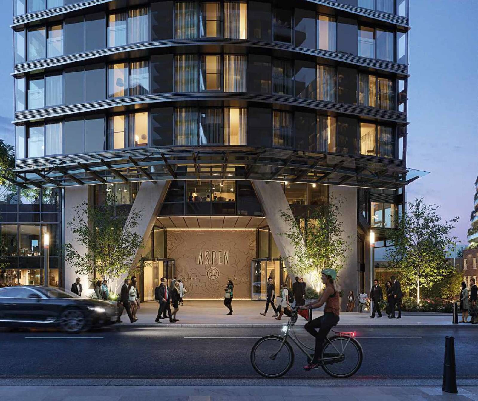 Modern residential building in Canary Wharf with glass facade and vibrant city surroundings.