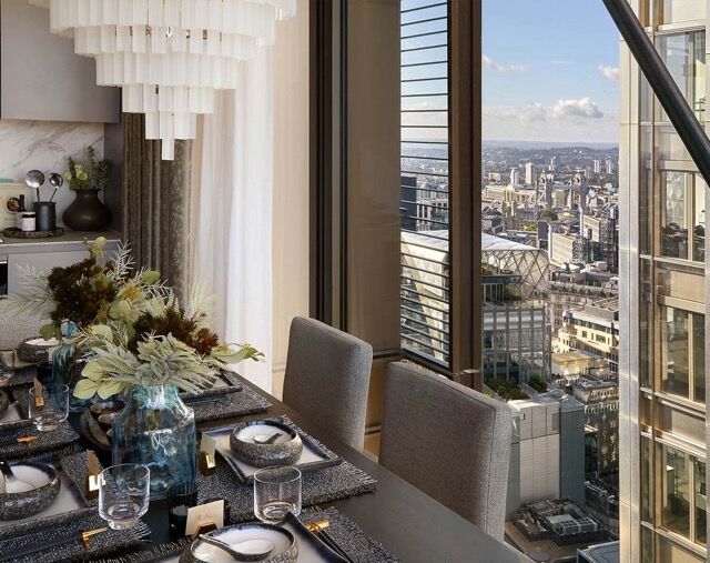 Luxury apartment dining area overlooking London skyline.