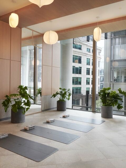 Elegant yoga studio with panoramic city views from Pan Pacific London.
