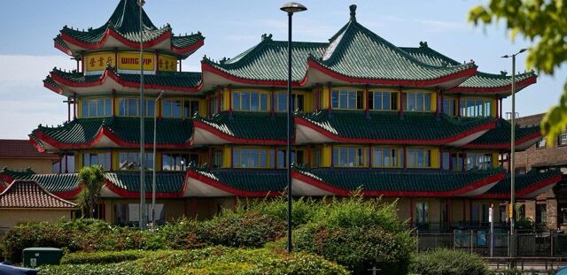 Traditional Asian pagoda with colorful, multi-tiered roofs and ornate design.