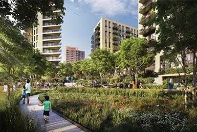 Modern residential buildings in Wembley with scenic waterside surroundings and lush greenery.