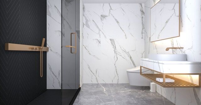 Elegant bathroom featuring marble walls, modern sink, and stylish decor.
