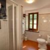 Spacious bathroom in a characteristic estate located in the Garfagnana region, featuring a shower, t.