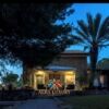 Beautiful villa overlooking the sea in Carloforte, featuring lush gardens and outdoor living spaces.