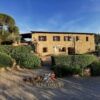 Farmhouse with scenic views of Val d'Orcia in Tuscany, featuring traditional stone architecture and.