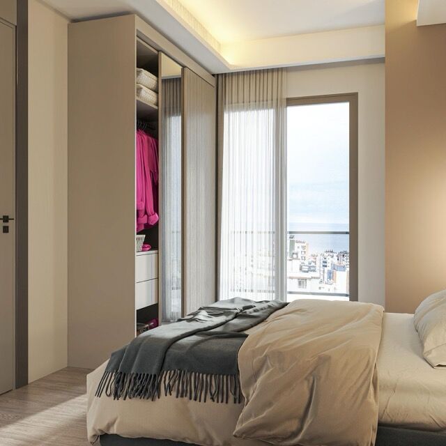 Apartment with sea view near the beach in Mersin. Modern interior with a cozy bedroom and large wind.