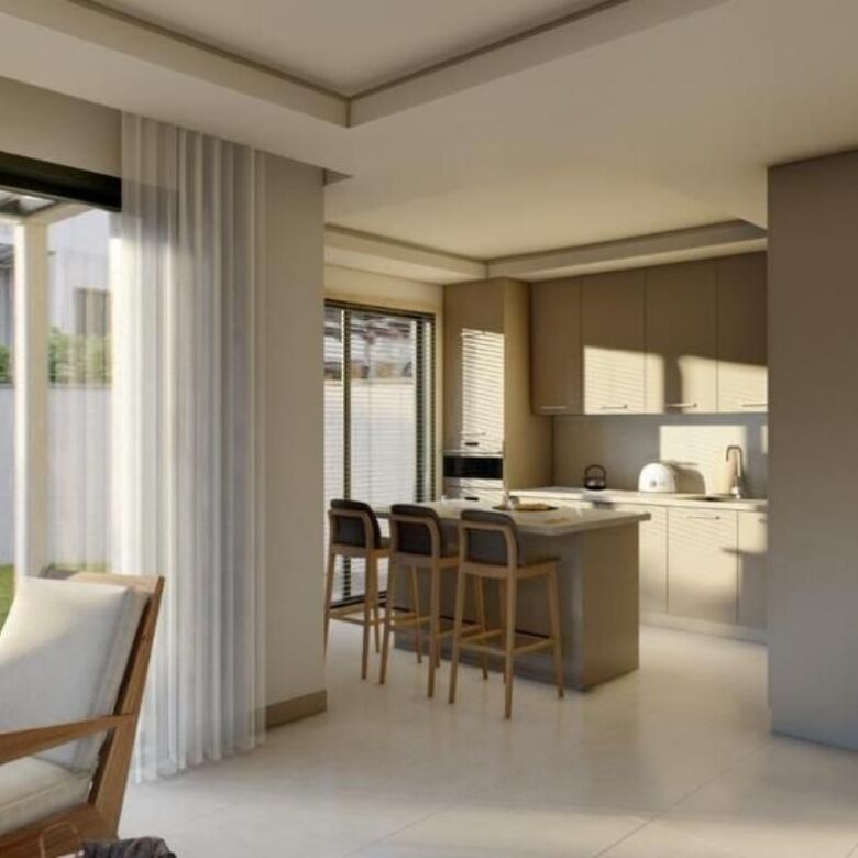 Luxurious villa interior featuring spacious living room and modern kitchen in Bodrum Gundogan.