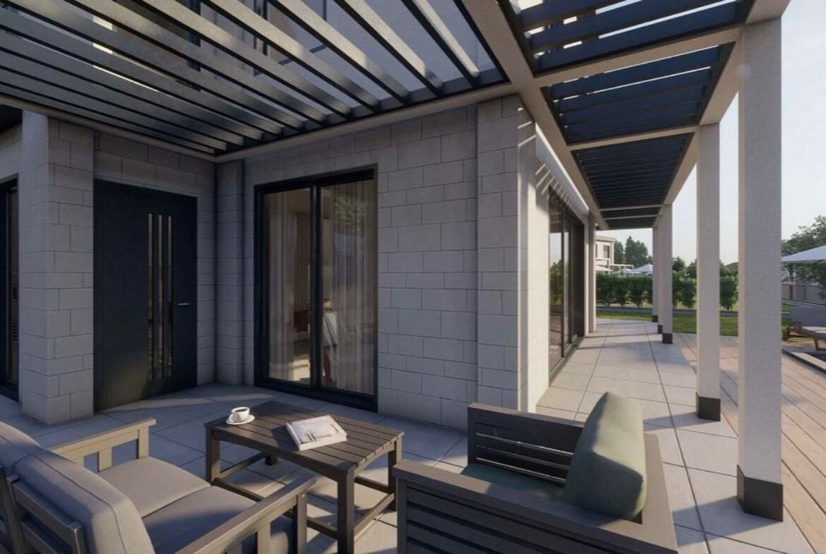 Modern Bodrum villa terrace with stylish outdoor seating and pergola.