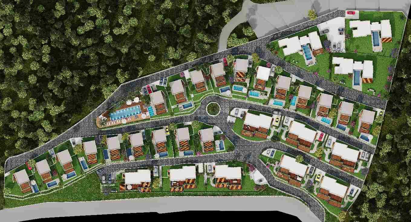 Aerial view of sea view properties in a gated complex with swimming pools in Bodrum.