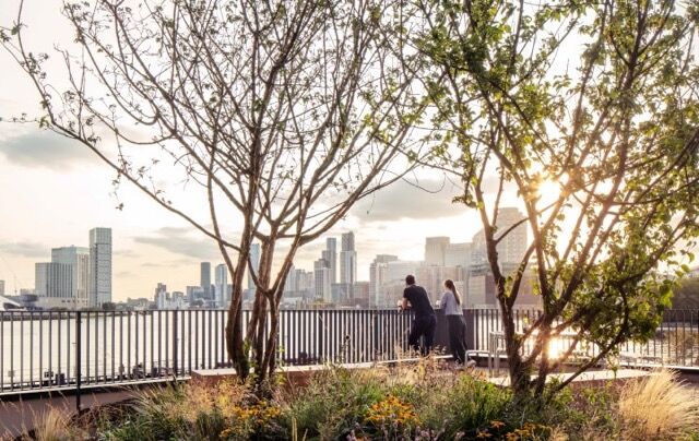 Riverside living with city skyline and natural greenery, perfect for heritage and style.