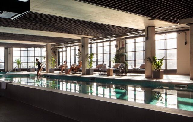 Luxury indoor pool with panoramic city views in Riverside Residences, London.