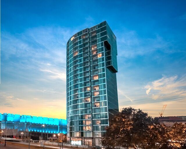 Modern high-rise building in Sheffield at sunset.