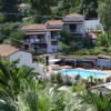 Villa Pappas for sale in Skiathos, Greek Islands, featuring a private pool and lush gardens.
