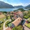 Elegant 5-bedroom lakeside villa in Lake Como, Italy, with stunning mountain views and lush gardens.