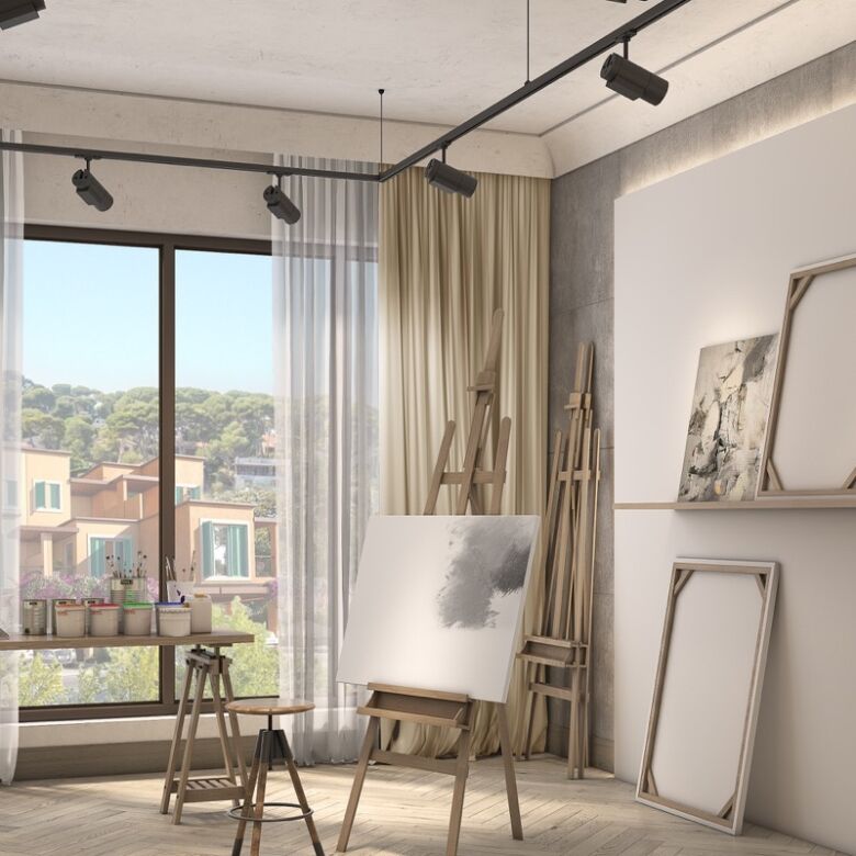 Bright interior with large windows overlooking Dubai skyline and island scenery.