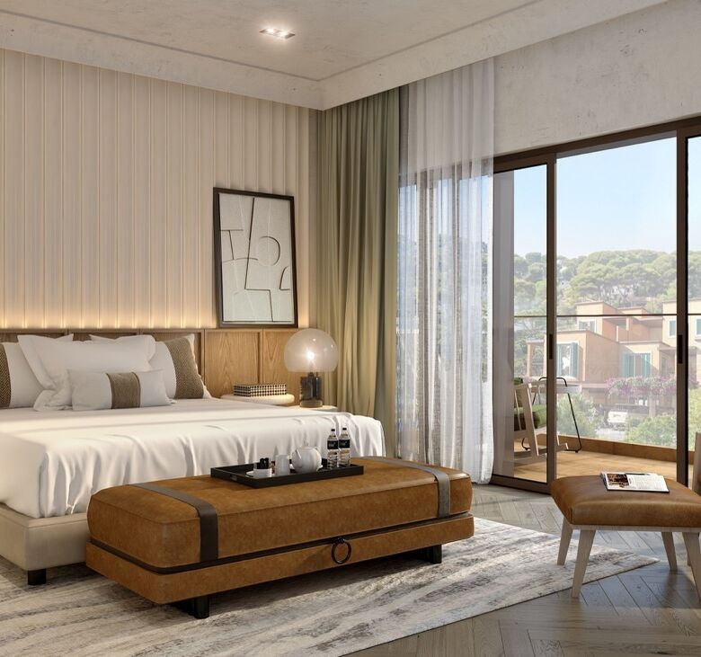 Elegant bedroom with contemporary decor and large windows overlooking scenic island views.