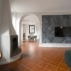 Spacious interior of a 4-bedroom house in Fino Mornasco, featuring modern decor and a cozy fireplace.