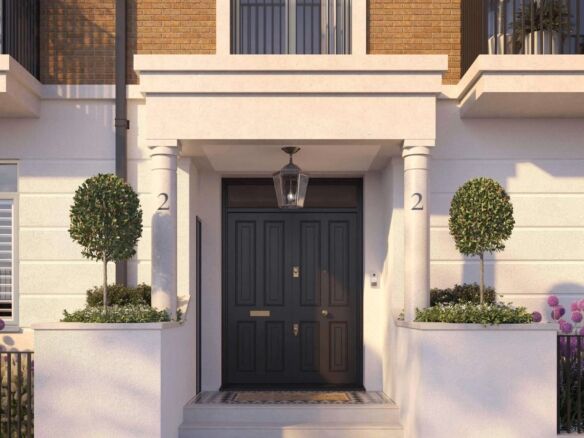 Townhouse entrance with elegant black door and lush greenery in Fulham.