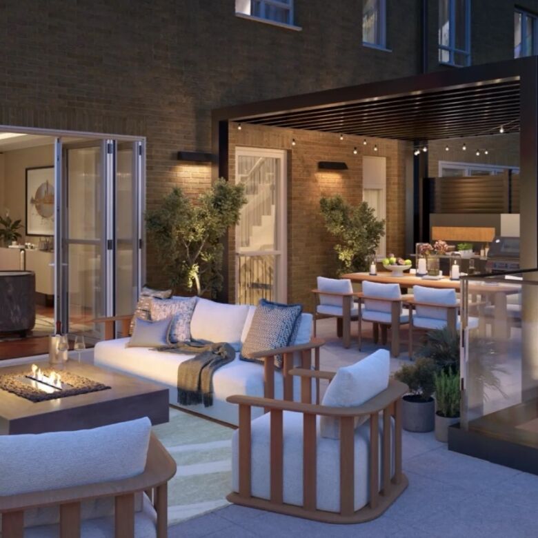 Elegant townhouse outdoor terrace with river views in Fulham. Modern furniture, cozy seating, and st.