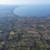 Aerial view of volcanic terrain meeting lush tropical wilderness near Ometepe Island.
