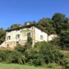 Charming estate with multiple properties for sale in Cortona, Tuscany, featuring traditional archite.