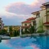 Pool view of luxury 1-bedroom apartment with lush surroundings in Vineyards Panorama, Aheloy.