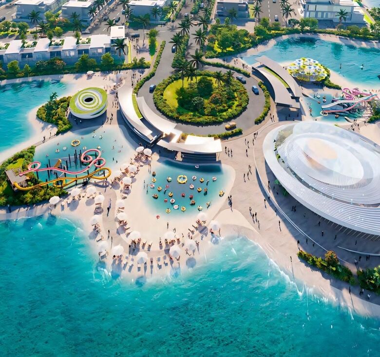 Aerial view of a luxurious island resort in Dubai with modern architecture and clear blue waters.
