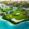 Stunning aerial view of a private island golf course in Dubai with lush greenery and water features.