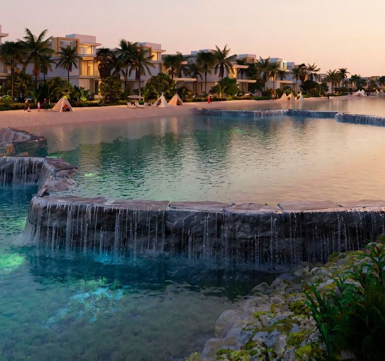 Secluded luxury pool with waterfalls at Dubai island resort.