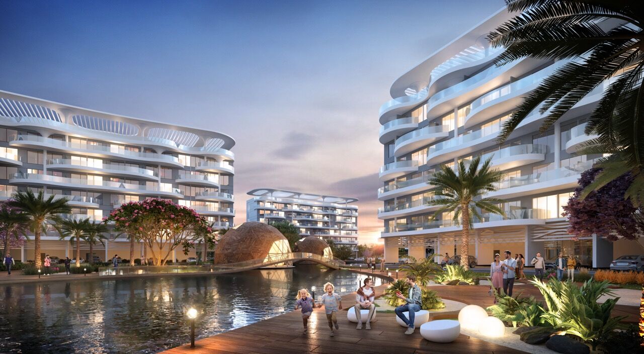 Luxurious waterfront apartments in Dubai overlooking serene lagoons and lush landscaping.