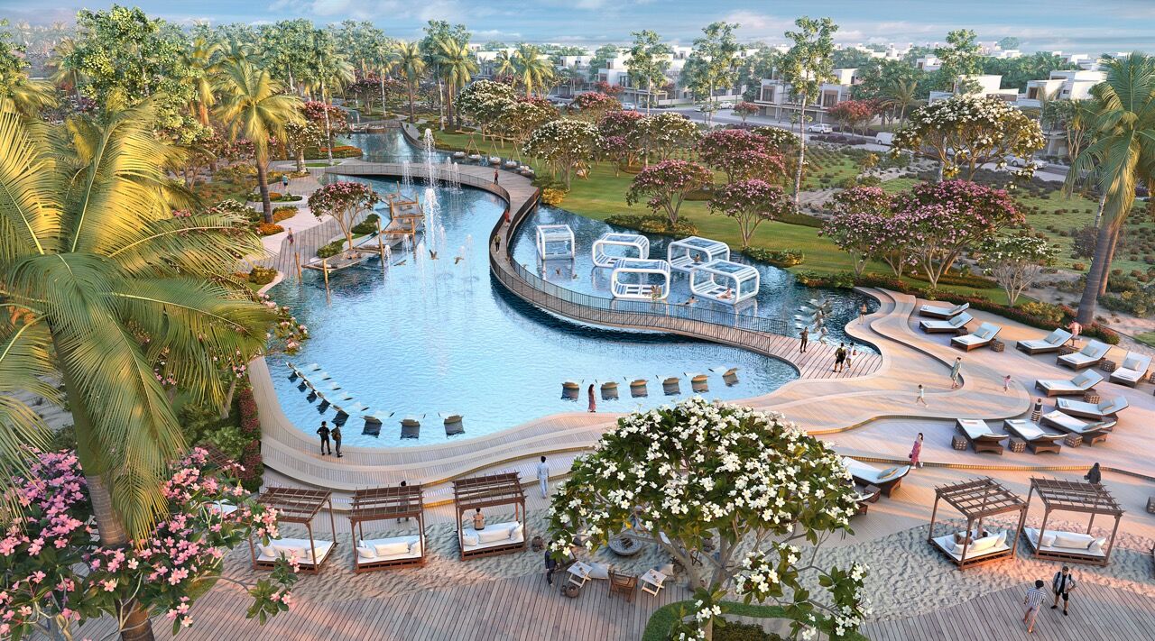 Lagoon-style pool with tropical landscaping in Dubai's Mykonos-inspired community.