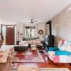 Spacious living room with contemporary furniture and cozy fireplace in Mola di Bari, Italy.