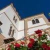 Historic property near Teramo with classic architecture and lush garden views.