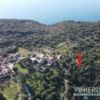 Land for sale in Kefalonia with sea views and lush surroundings.