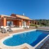 Luxury villa with swimming pool and outdoor seating in Sao Bras De Alportel, Algarve, Portugal.